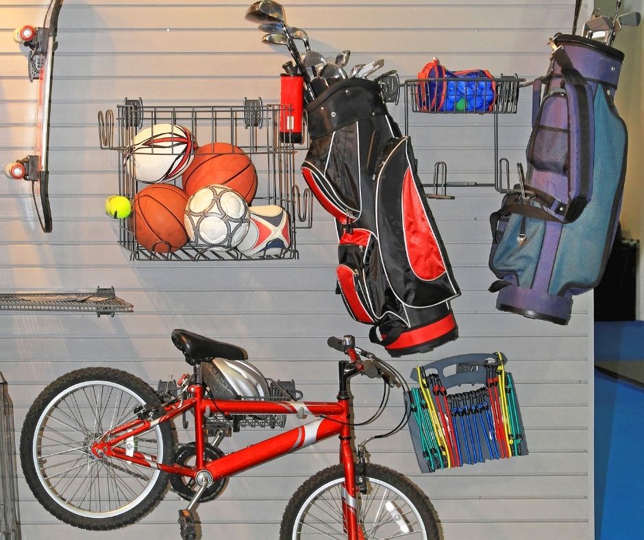 Everyday garage items like a mower and tools stored within easy reach